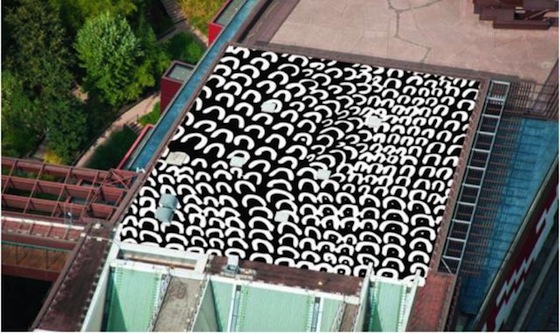 A black and white abstract work is created by stencils and with the same kind of rubberized paint used for traffic signs. The 700-square-meter installation has been designed to be visible from several different levels of the nearby Eiffel Tower, which draws in around 7 million visitors every year.