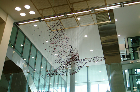 Philadelphia International Airport (PHL) has a robust program of temporary exhibitions and permanent work. Included is the crowd-pleasing Impulse, by Ralph Helmick and Stuart Schecter, in Terminal A – West. The piece features over 6,500 cast models of bird species suspended on 5,302 cables. Altogether, they appear to lift into flight and transform from a waterfowl into a passenger jet. 